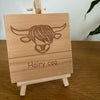 Wooden coaster gift - Scottish highland cow - hairy coo - displayed on an easel