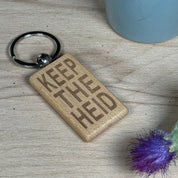 Wooden keyring laser engraved with Scottish dialect keep the heid