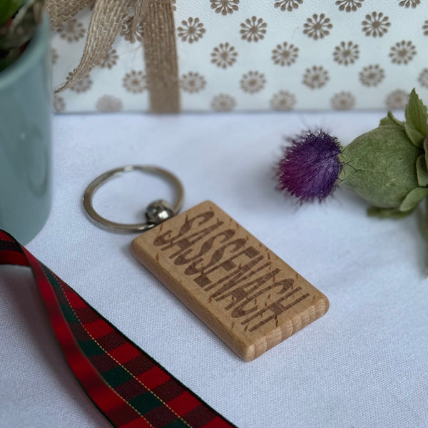 Wooden keyring laser engraved with Scottish dialect sassenach