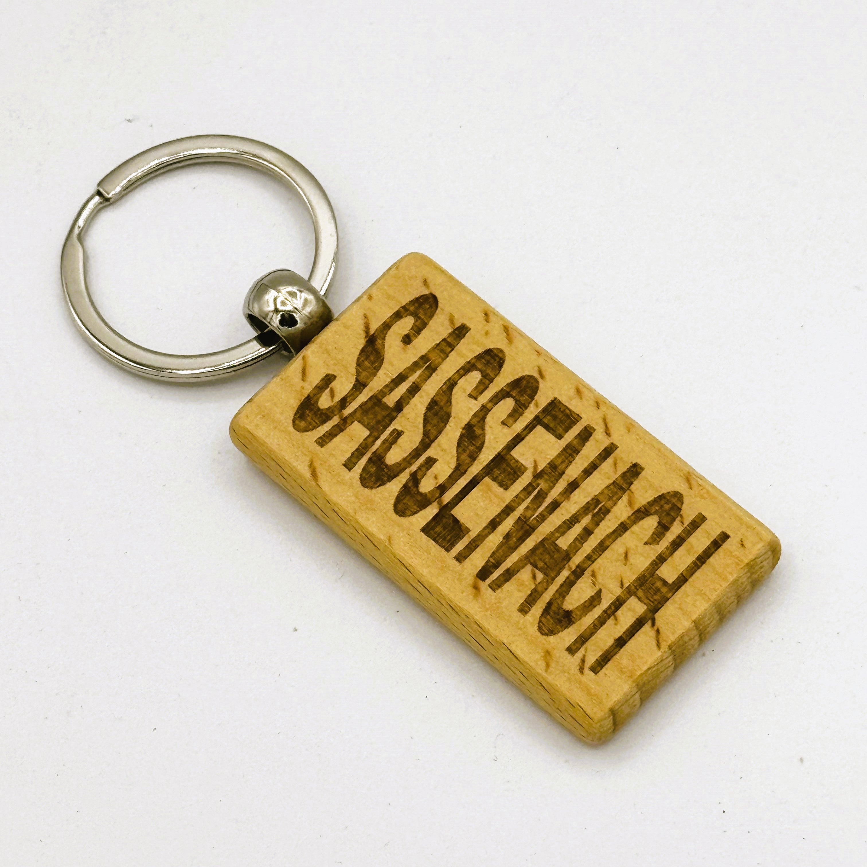 Wooden keyring laser engraved with Scottish dialect sassenach