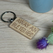 Wooden keyring laser engraved with Scottish dialect - away an' bile yer heid