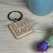 Wooden keyring laser engraved with Scottish dialect bawbag