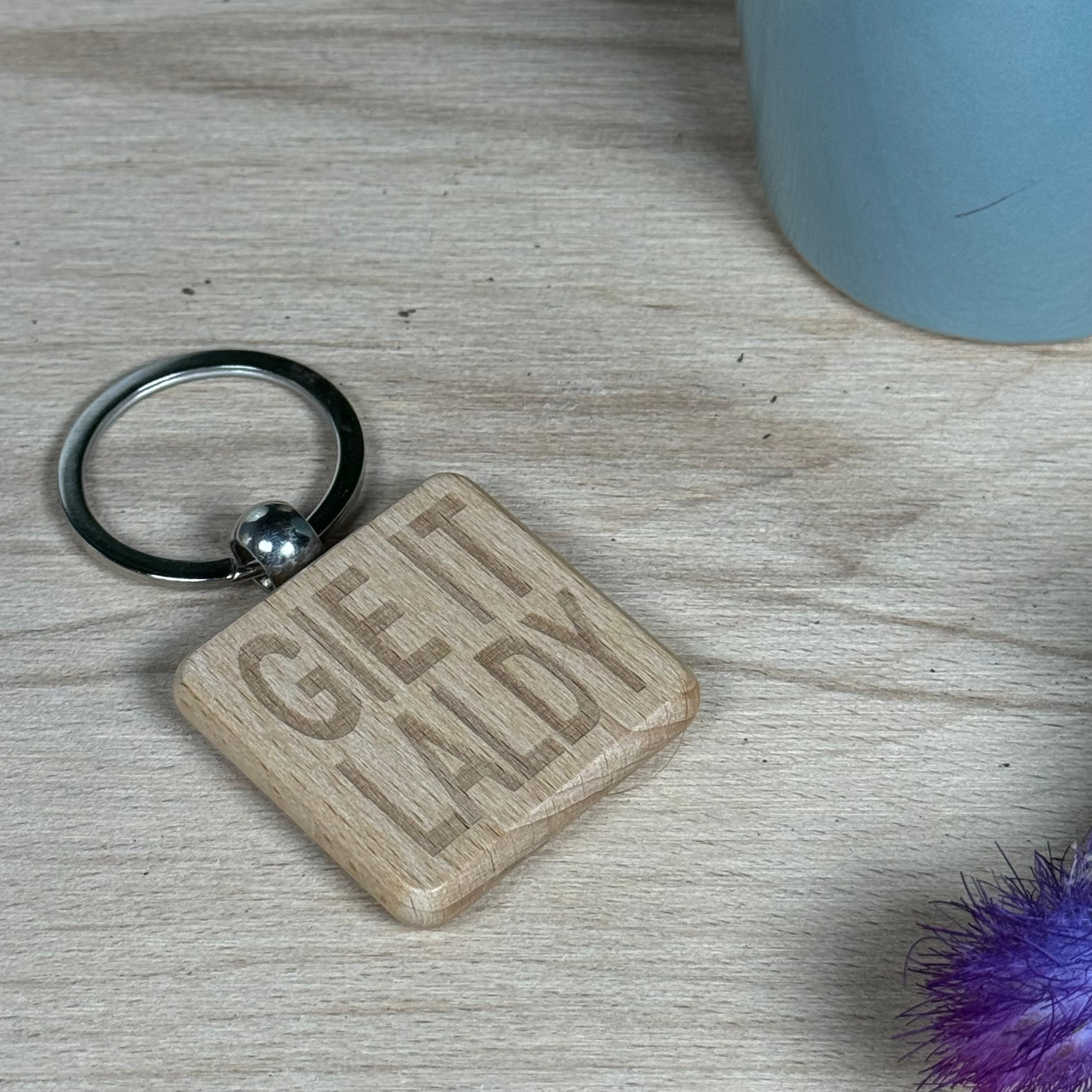 Wooden keyring laser engraved with Scottish dialect - gie it laldy