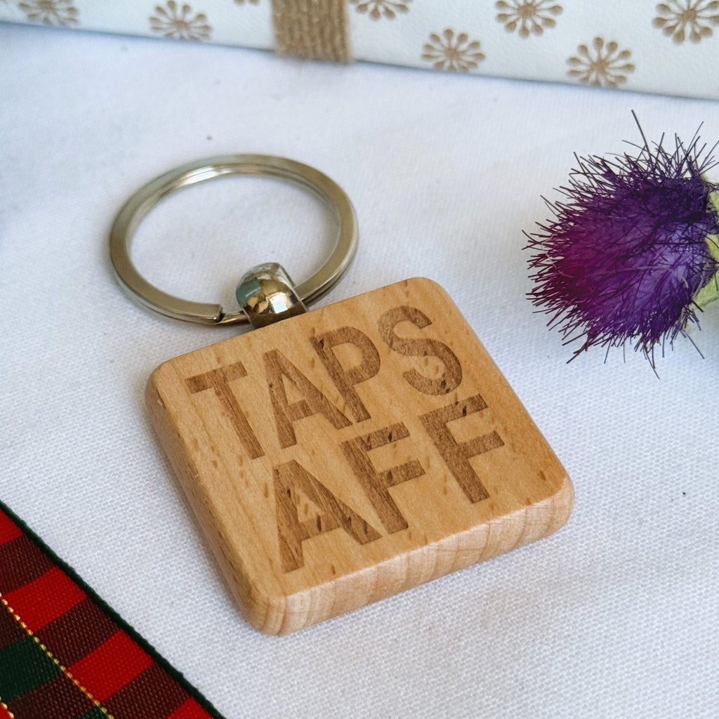 Wooden keyring laser engraved with Scottish dialect - taps aff