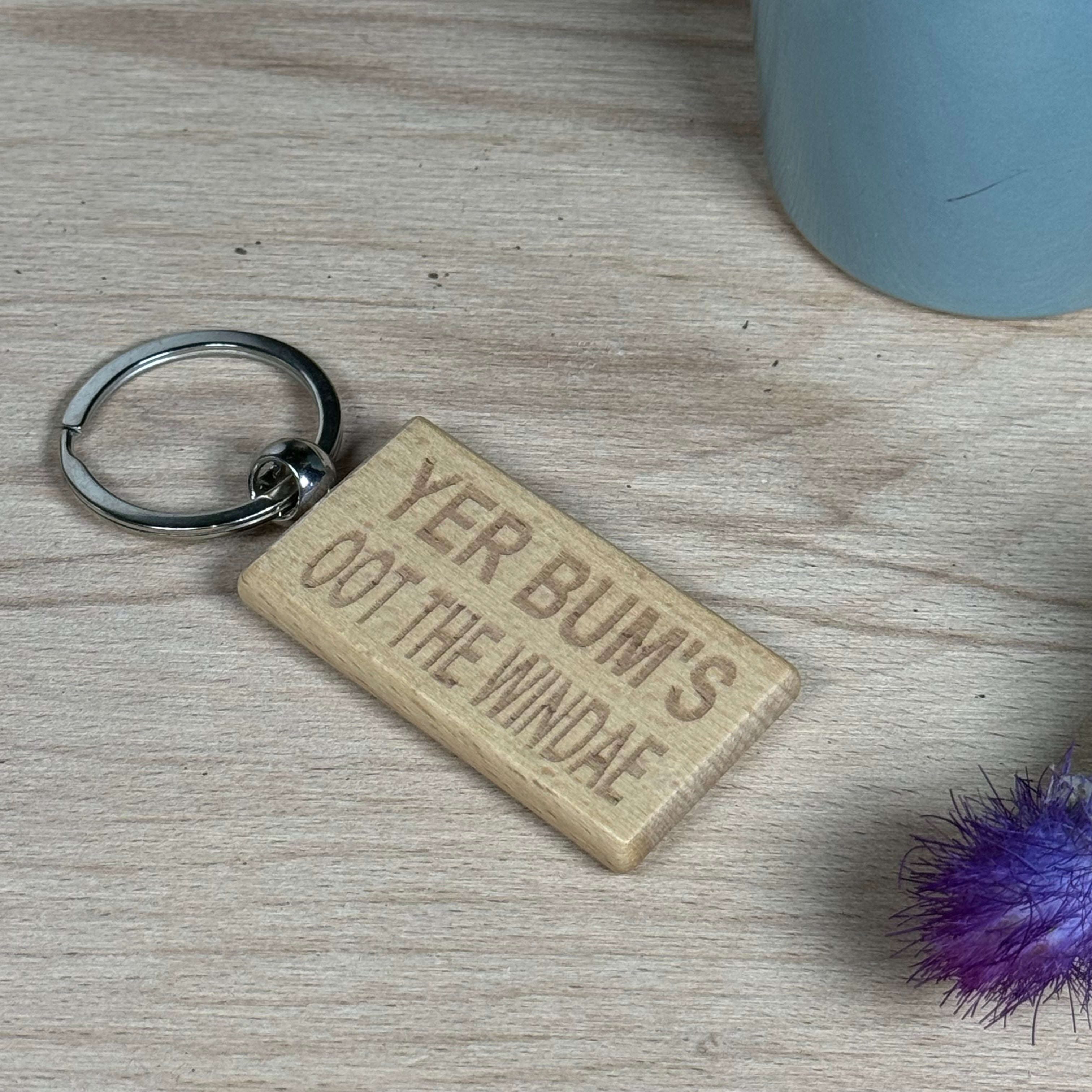 Wooden keyring laser engraved with Scottish dialect - yer bum's oot the windae