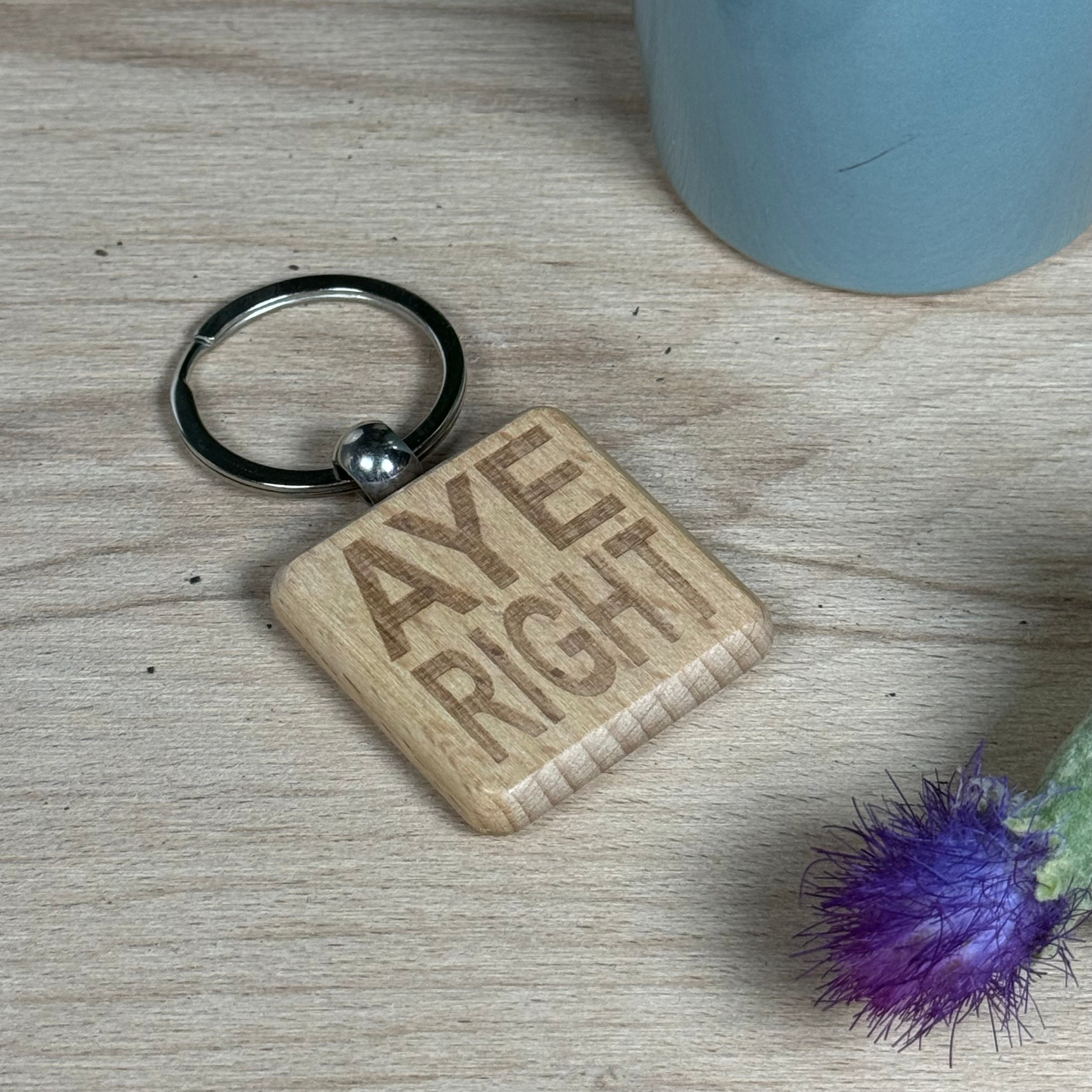 Wooden keyring laser engraved with Scottish dialect aye right