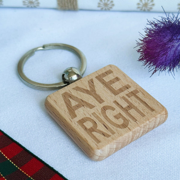 Wooden keyring laser engraved with Scottish dialect aye right