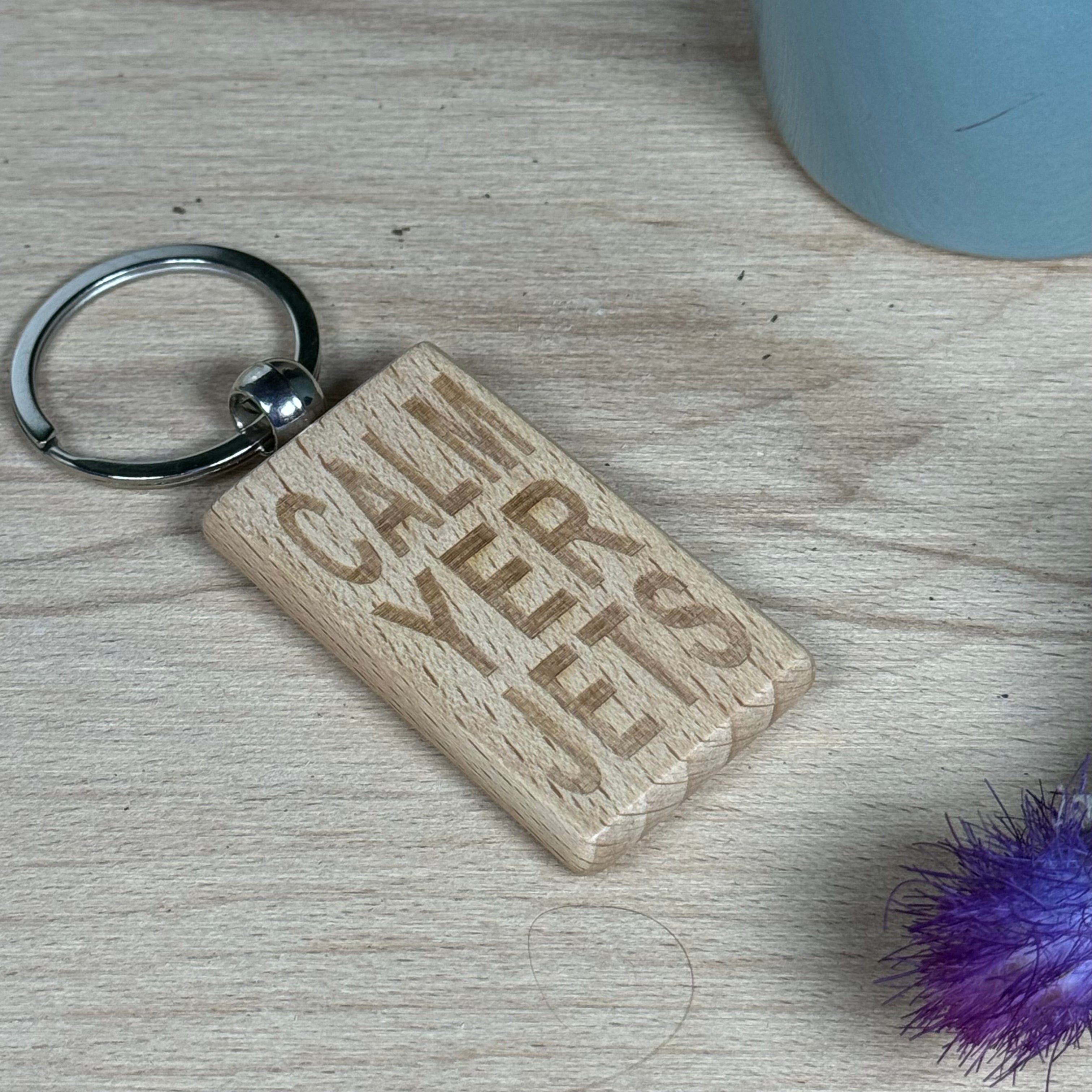 Wooden keyring laser engraved with Scottish dialect calm yer jets