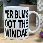 Ceramic mug - Scottish dialect - yer bum's oot the windae