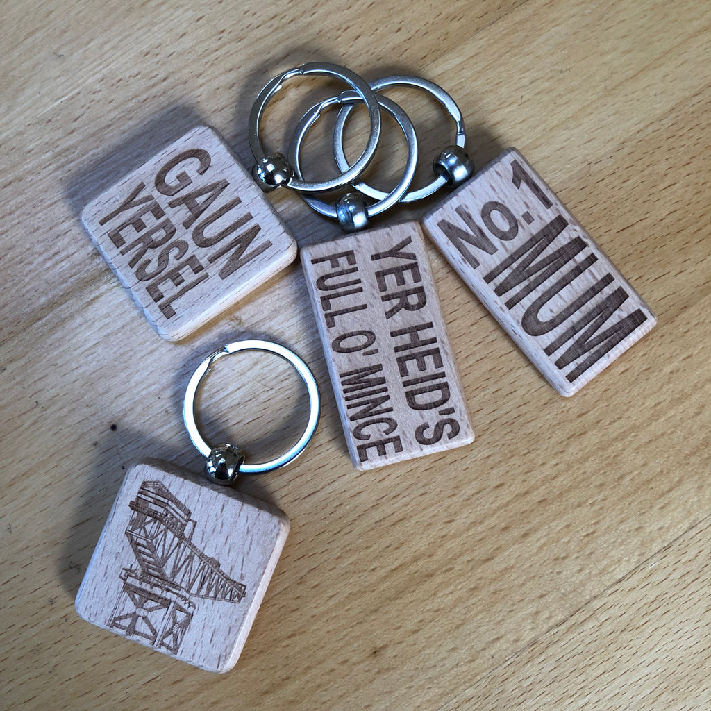 Wooden keyring laser engraved with Scottish dialect - up tae high doh
