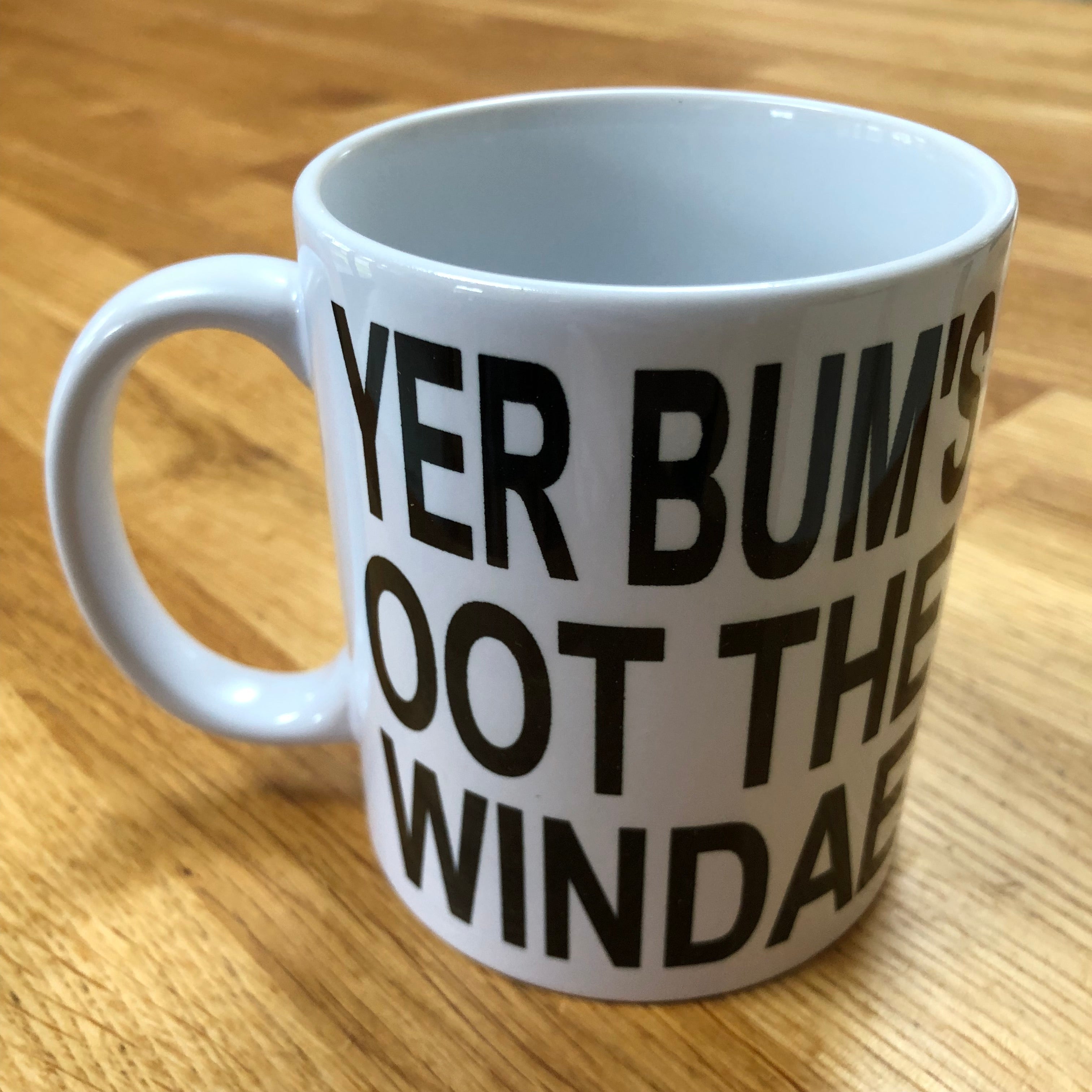 Ceramic mug - Scottish dialect - yer bum's oot the windae