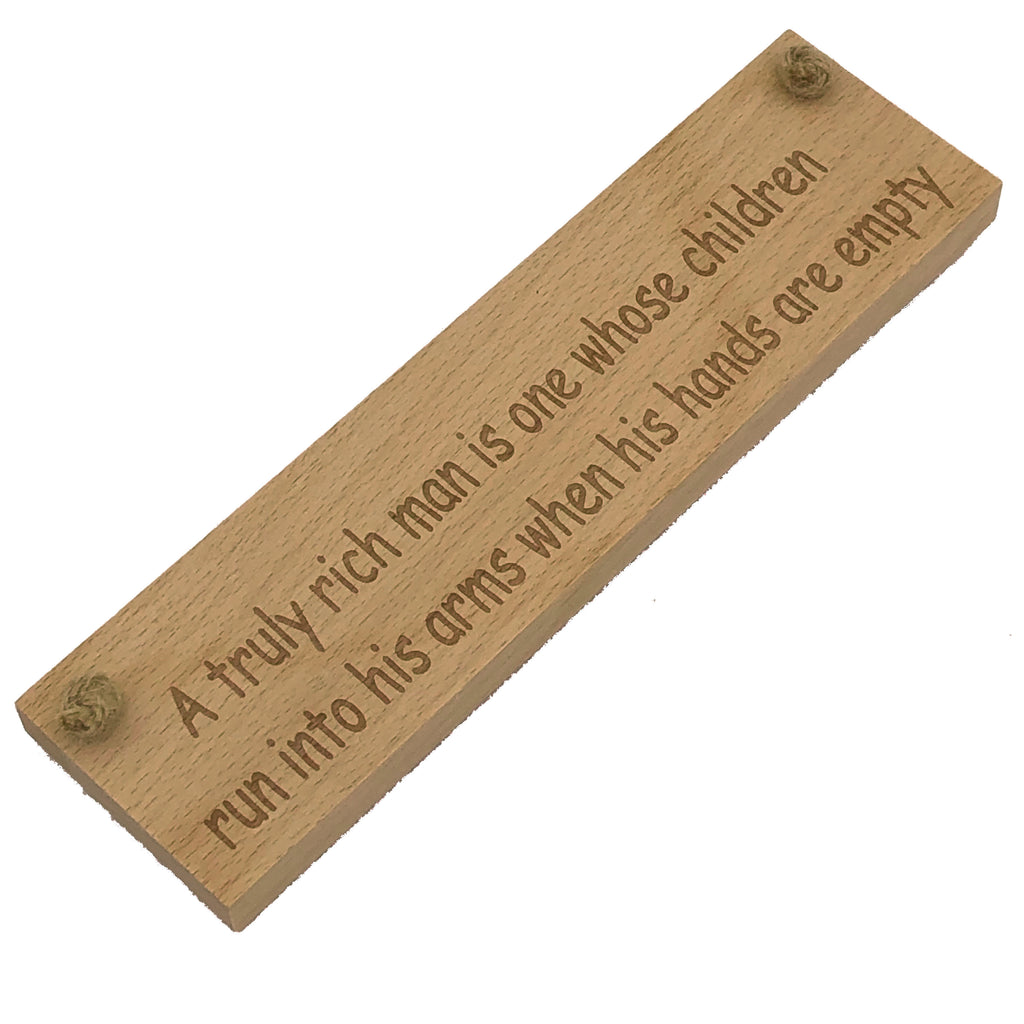 Wooden hanging plaque - a truly rich man