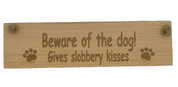 Wooden plaque - beware of the dog - gives slobbery kisses