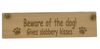 Wooden plaque - beware of the dog - gives slobbery kisses